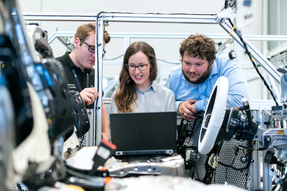 Engineers at machine